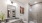 Model bathroom at our apartments in Midland, featuring grey countertops and a shower with sliding glass doors.