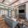 Lounge at our apartments in Midland, TX, featuring a flat screen TV, rustic decor, and a view of our co working spaces. 